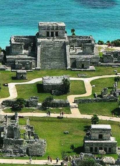 Aerial view of the walled Tulum ruins above the Caribbean
